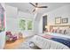 Bright bedroom with large windows, seating area, stylish furnishings, and comfortable decor at 1336 Courtland Dr, Raleigh, NC 27604