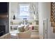 Cozy nook in the living room featuring a bookcase, decor, and a window view at 1336 Courtland Dr, Raleigh, NC 27604