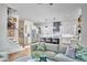Open living space with a modern kitchen, staircase, and view of the living area at 1336 Courtland Dr, Raleigh, NC 27604