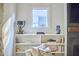 Cozy nook in the living room featuring a bookcase, decor, and a window view at 1336 Courtland Dr, Raleigh, NC 27604