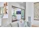 Bright living room leading into the sunroom with sliding glass doors at 1336 Courtland Dr, Raleigh, NC 27604