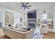 Bright living room featuring a fireplace, a ceiling fan, and stylish furniture at 1336 Courtland Dr, Raleigh, NC 27604