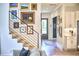 Stylish staircase featuring open steps, a modern railing, and artistic wall decor, enhancing the home's appeal at 1336 Courtland Dr, Raleigh, NC 27604