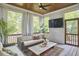 Relaxing sunroom features wood paneled ceiling, white walls, comfortable seating and scenic outdoor views at 1336 Courtland Dr, Raleigh, NC 27604