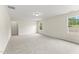 Bright bedroom with neutral carpet, baseboards, and dual windows allowing natural light at 134 Ivy Ridge Rd, Chapel Hill, NC 27516