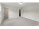 Bright bedroom with neutral carpet, baseboards, and multiple doorways at 134 Ivy Ridge Rd, Chapel Hill, NC 27516