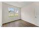 This bedroom has neutral walls, hardwood floors, and large windows at 134 Ivy Ridge Rd, Chapel Hill, NC 27516