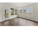 Bright dining area with hardwood floors and large windows that provide plenty of natural light at 134 Ivy Ridge Rd, Chapel Hill, NC 27516