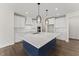 This spacious kitchen features a large island, stainless steel appliances, and modern pendant lighting at 134 Ivy Ridge Rd, Chapel Hill, NC 27516