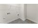 A useful laundry room with tile floors and an overhead rack, perfect for organization at 134 Ivy Ridge Rd, Chapel Hill, NC 27516