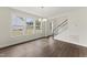 Open living area with hardwood floors, staircase and dining area at 134 Ivy Ridge Rd, Chapel Hill, NC 27516