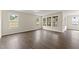 Bright living room with hardwood floors and large windows overlooking the backyard at 134 Ivy Ridge Rd, Chapel Hill, NC 27516
