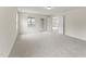 Loft area featuring neutral carpet, natural light, a doorway, and glass paneled door at 134 Ivy Ridge Rd, Chapel Hill, NC 27516