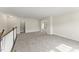 Upstairs loft area with neutral carpet, recessed lighting, and two open doorways at 134 Ivy Ridge Rd, Chapel Hill, NC 27516