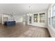 Open floorplan featuring hardwood floors that connects the kitchen island to the dining and living areas at 134 Ivy Ridge Rd, Chapel Hill, NC 27516