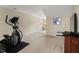 Finished basement with neutral carpet, providing ample space for exercise or recreational activities at 15 Plumas Drive Dr, Durham, NC 27705