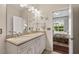Bathroom featuring a double vanity with granite countertops and a view into the bedroom at 15 Plumas Drive Dr, Durham, NC 27705