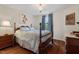 Bedroom featuring hardwood floors, a chandelier, a large window, and classic decor with furniture at 15 Plumas Drive Dr, Durham, NC 27705