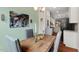 Dining area with modern decor adjacent to kitchen featuring stainless appliances at 15 Plumas Drive Dr, Durham, NC 27705