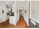 Inviting entryway with hardwood floors and arched doorways leading to the kitchen and living spaces at 15 Plumas Drive Dr, Durham, NC 27705