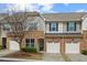Charming townhome with a stone facade, one-car garage and manicured landscaping at 15 Plumas Drive Dr, Durham, NC 27705