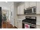 Well-equipped kitchen featuring granite countertops and stainless steel appliances at 15 Plumas Drive Dr, Durham, NC 27705