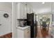 Kitchen featuring granite countertops, stainless steel appliances, and a large black refrigerator at 15 Plumas Drive Dr, Durham, NC 27705