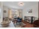 Home office featuring a desk, bookcase, hardwood floors, and a comfortable chair, perfect for productivity at 15 Plumas Drive Dr, Durham, NC 27705