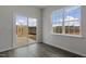 Bright and airy room with sliding glass doors leading to an outdoor space and natural light at 152 Global Ave, Fuquay Varina, NC 27526