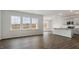 Bright open-concept space with abundant windows, gray cabinets, and an island kitchen at 152 Global Ave, Fuquay Varina, NC 27526