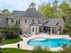 Aerial view of an estate showcasing a backyard swimming pool, outdoor entertaining space, and beautifully landscaped grounds at 16106 Morehead, Chapel Hill, NC 27517