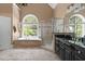 The spacious bathroom features a large tub and walk-in shower with black cabinets at 16106 Morehead, Chapel Hill, NC 27517