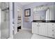 Stylish bathroom features black and white mosaic tile flooring and a walk-in shower at 16106 Morehead, Chapel Hill, NC 27517
