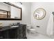 Powder room boasts ornate fixtures, granite countertop, and decorative mirrors at 16106 Morehead, Chapel Hill, NC 27517