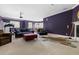 Spacious recreation room featuring multiple seating areas and a stylish zebra rug at 16106 Morehead, Chapel Hill, NC 27517