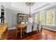 Elegant dining room with hardwood floors, chandelier, and large arched windows at 16106 Morehead, Chapel Hill, NC 27517