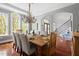 Elegant dining room with hardwood floors, chandelier, and large arched windows at 16106 Morehead, Chapel Hill, NC 27517