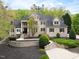 Elegant brick home boasts manicured landscaping and a welcoming front entrance at 16106 Morehead, Chapel Hill, NC 27517