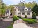Elegant brick home boasts manicured landscaping and a welcoming front entrance at 16106 Morehead, Chapel Hill, NC 27517