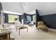 Spacious living room with comfortable seating and large windows allowing for natural light at 16106 Morehead, Chapel Hill, NC 27517