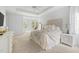 Serene main bedroom with white walls, plush carpeting, and an attached sitting area with bright windows at 16106 Morehead, Chapel Hill, NC 27517