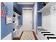 Functional mudroom with built-in benches, storage shelves, and coat hooks for organization at 16106 Morehead, Chapel Hill, NC 27517