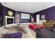 Entertainment room with projector screen, plush seating, and a cozy fireplace at 16106 Morehead, Chapel Hill, NC 27517