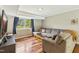 Relaxing basement living area with comfortable seating, a TV, and natural light at 1624 Cone Ave, Apex, NC 27502