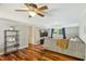 Finished basement with hardwood floors, a large sectional couch, and a TV at 1624 Cone Ave, Apex, NC 27502