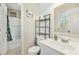 Clean bathroom with vanity, mirror, and shower-tub combo at 1624 Cone Ave, Apex, NC 27502