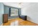 The bedroom is freshly painted and boasts stylish decor and hardwood floors at 1624 Cone Ave, Apex, NC 27502