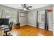 Inviting bedroom features hardwood floors, two windows, and a ceiling fan at 1624 Cone Ave, Apex, NC 27502