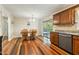 Bright dining area featuring a dining table with chairs and access to the outdoor patio at 1624 Cone Ave, Apex, NC 27502