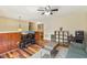 Living room with hardwood floors, a TV, and a view into the dining area at 1624 Cone Ave, Apex, NC 27502